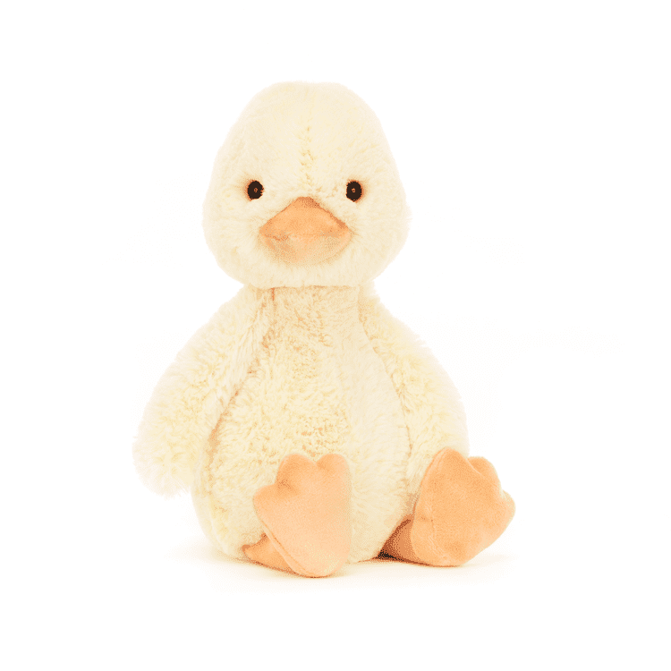 Bashful Duckling Jellycat plushie faces the camera on a white background