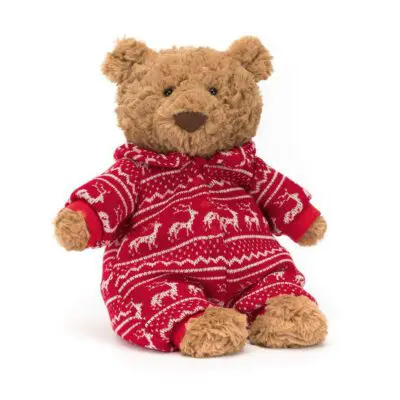 Bartholomew Bear wearing a red onesie with a white Christmas pattern